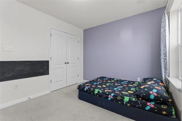 a bedroom with a bed