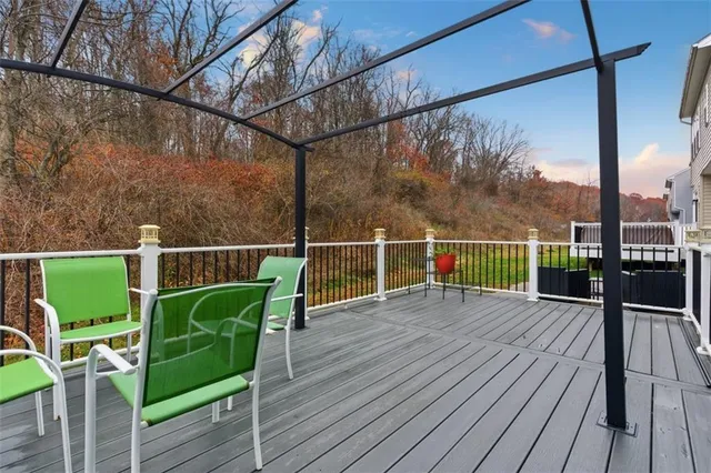 a view of a balcony with wooden floor