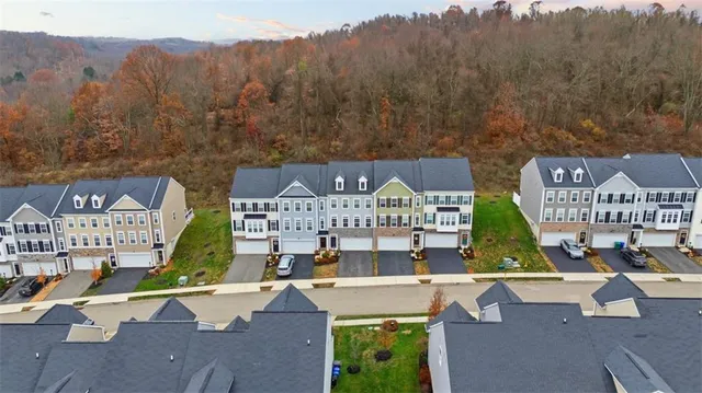 an aerial view of a house with a garden