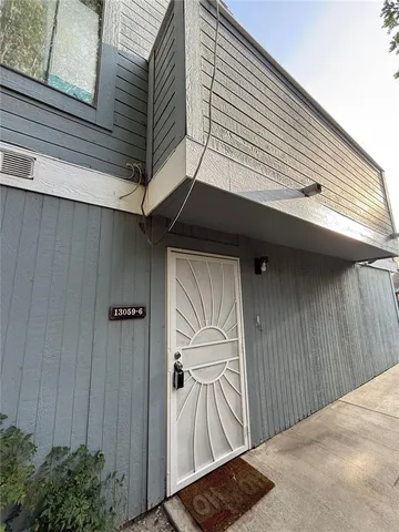 a view of a wooden door of the house