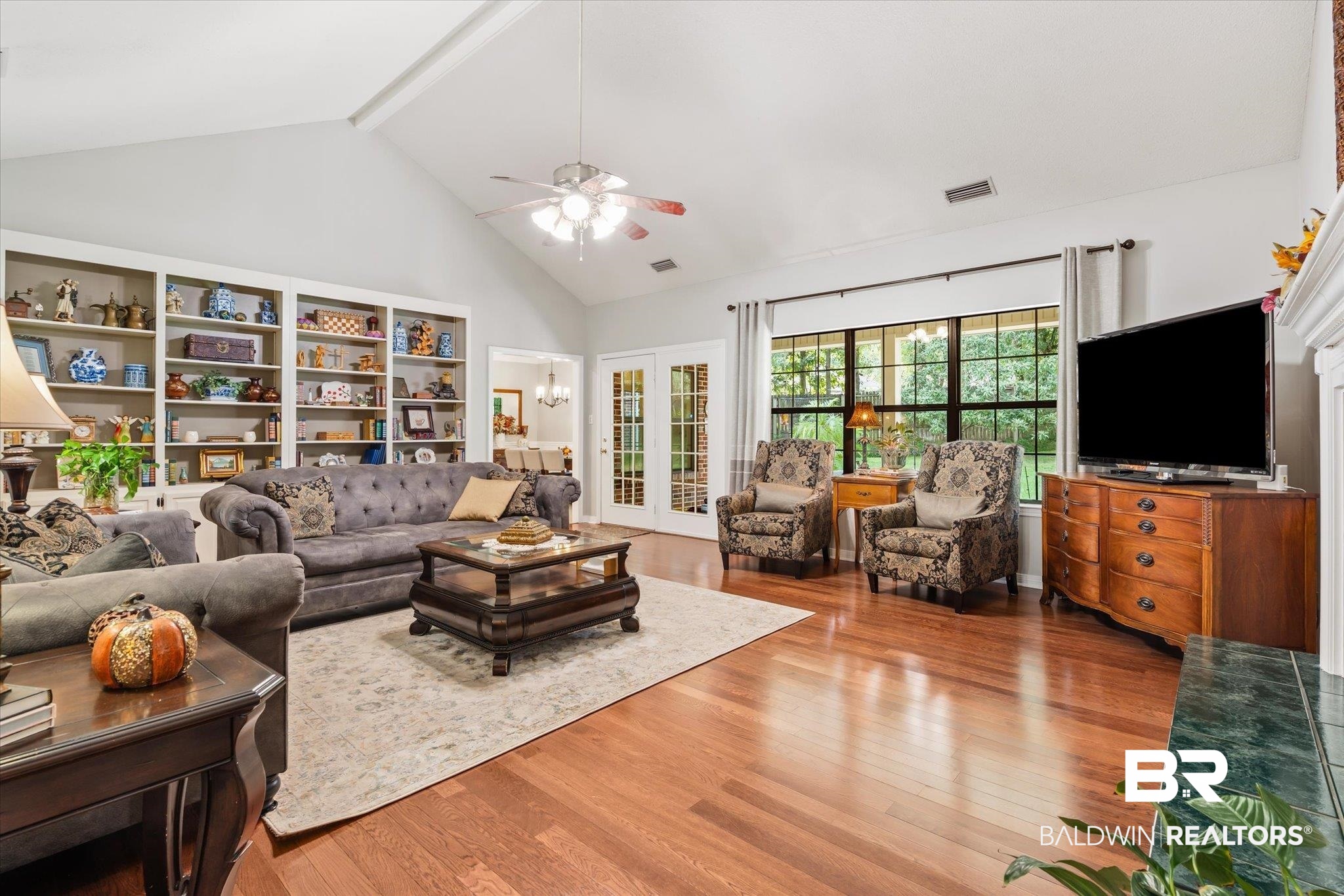 7360 Bridgewood Court Mobile, AL 36695 - Photo 12 of 30 Living room with high vaulted ceiling, beamed ceiling, ceiling fan, and wood-type flooring