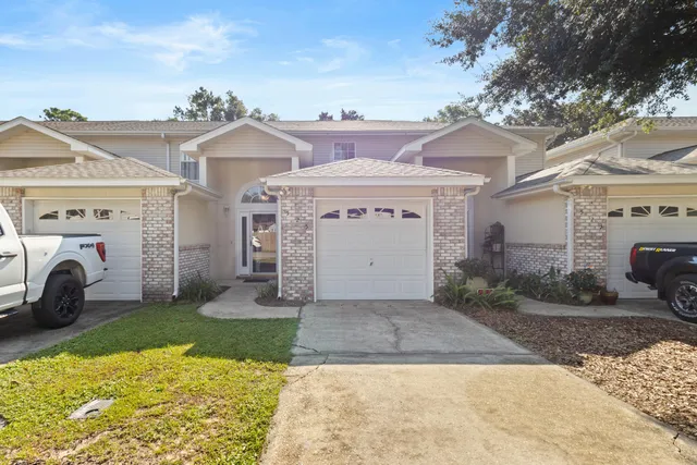 a view of a white house with a outdoor space