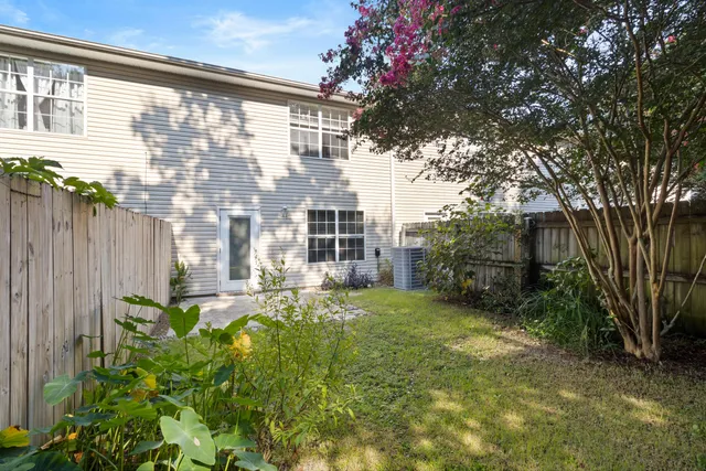 a view of backyard with patio