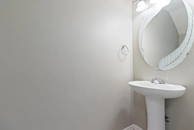 a bathroom with a sink and mirror