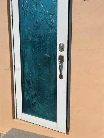 a bathroom with a shower and mirror