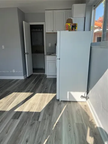 a view of a kitchen from the hallway