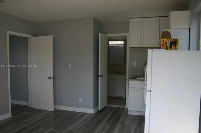 a view of a storage & utility room with closet area