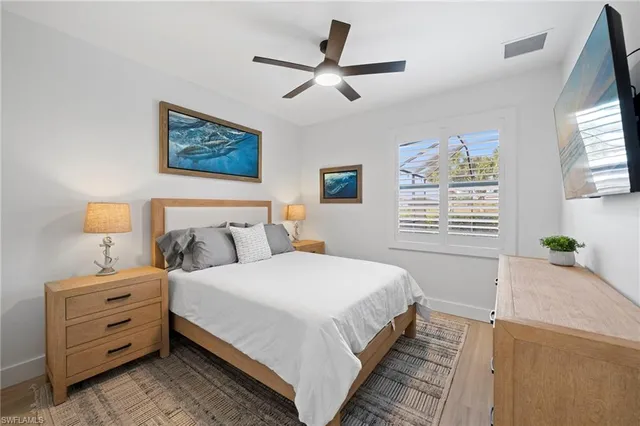 a bedroom with bed and window