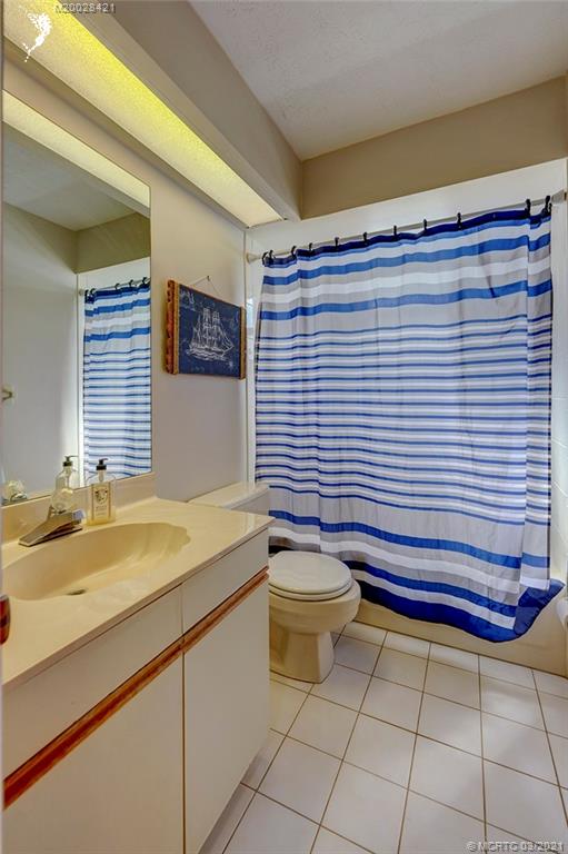 4918 Southeast Salvatori Road Stuart, FL 34997 - Photo 16 of 37 a bathroom with a sink and a toilet