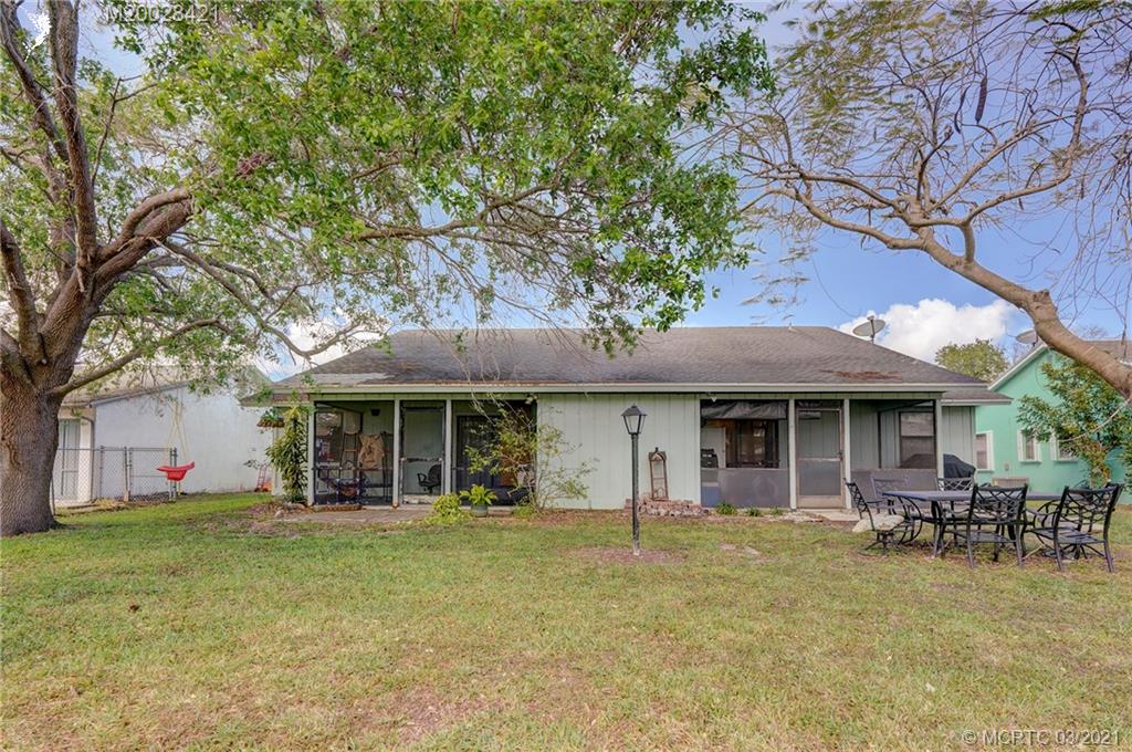 4918 Southeast Salvatori Road Stuart, FL 34997 - Photo 37 of 37 a front view of a house with garden