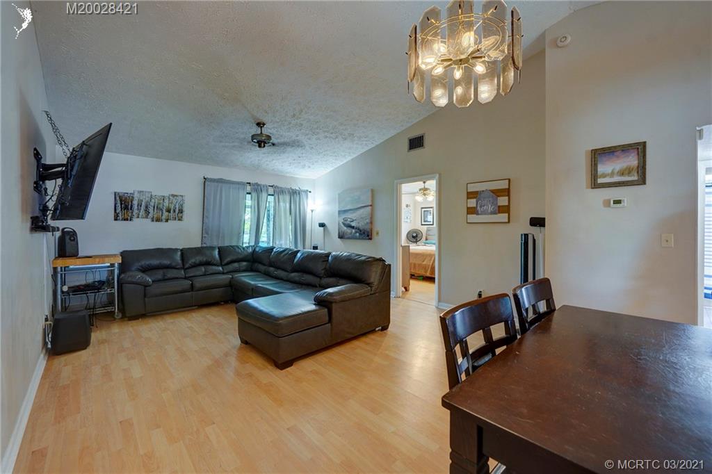 4918 Southeast Salvatori Road Stuart, FL 34997 - Photo 6 of 37 a living room with furniture