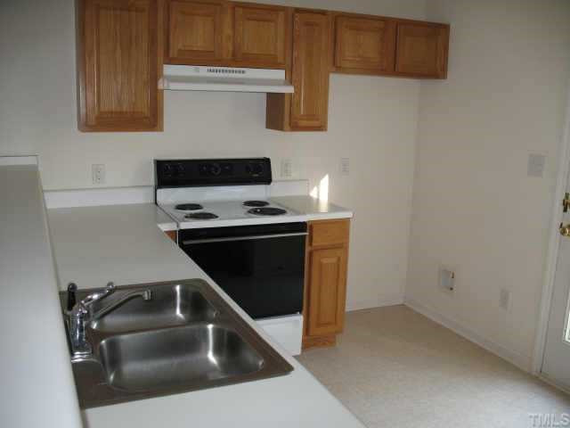 Kitchen with range/oven, dishwasher and french door access to deck. Other