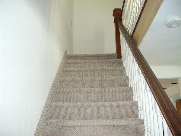 633 Plantation Street Worcester, MA 01605 - Photo 14 of 24 a view of staircase with white walls