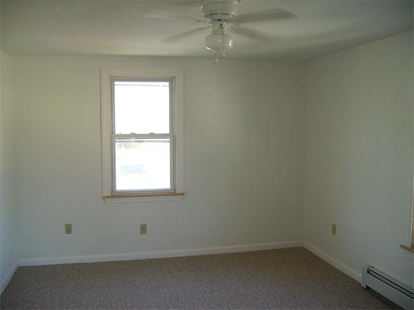 633 Plantation Street Worcester, MA 01605 - Photo 18 of 24 an empty room with a window