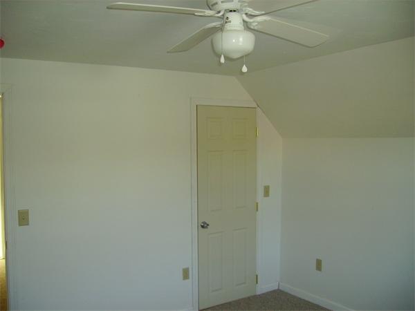 633 Plantation Street Worcester, MA 01605 - Photo 19 of 24 a view of a hallway with a chandelier fan