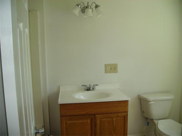 633 Plantation Street Worcester, MA 01605 - Photo 23 of 24 a bathroom with a sink toilet and vanity