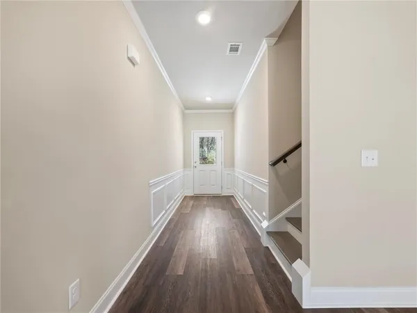 a view of entryway with wooden floor