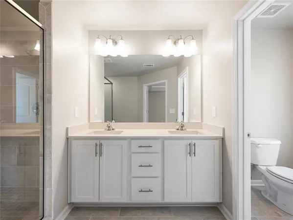 a white toilet sitting next to a window