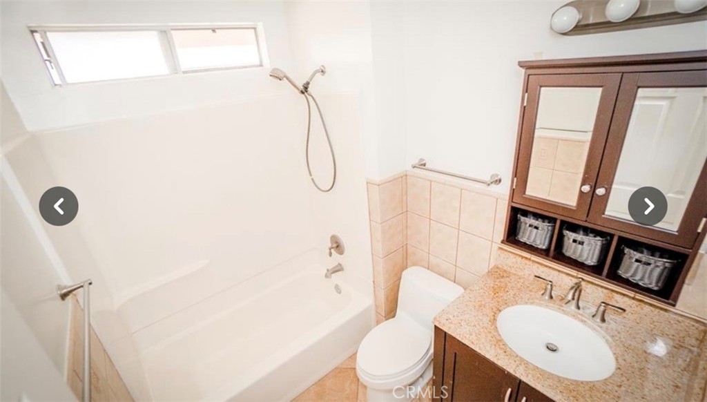 9846 California South Gate, CA 90280 - Photo 6 of 9 a bathroom with a sink toilet and shower