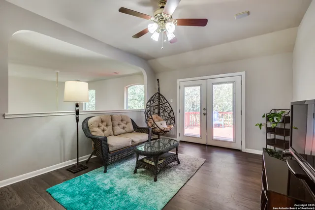a living room with furniture and a gate