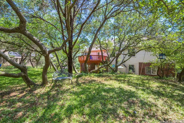 a backyard of a house with lots of green space