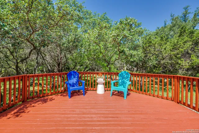 a park view with a bench and trees