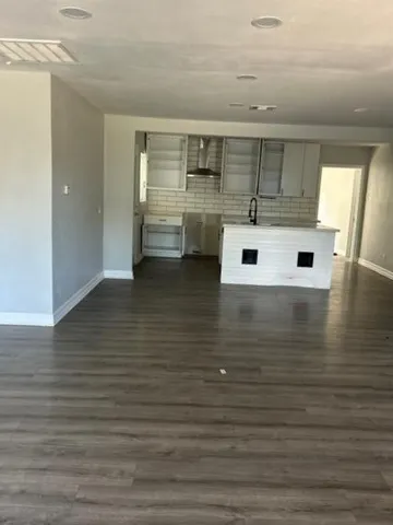 a view of a hardwood floor in a room