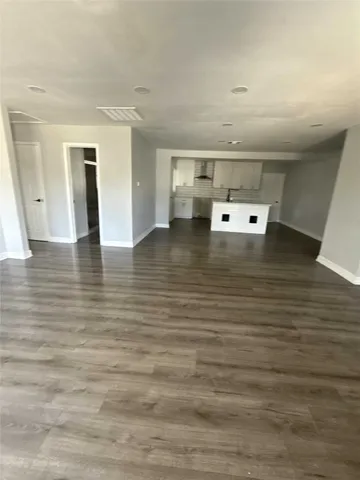 a view of a livingroom with wooden floor