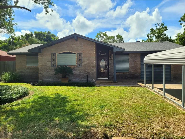 a house view with a garden space