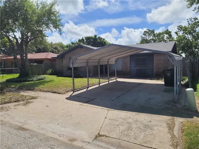 a backyard of a house with portable swimming pool and basket ball court