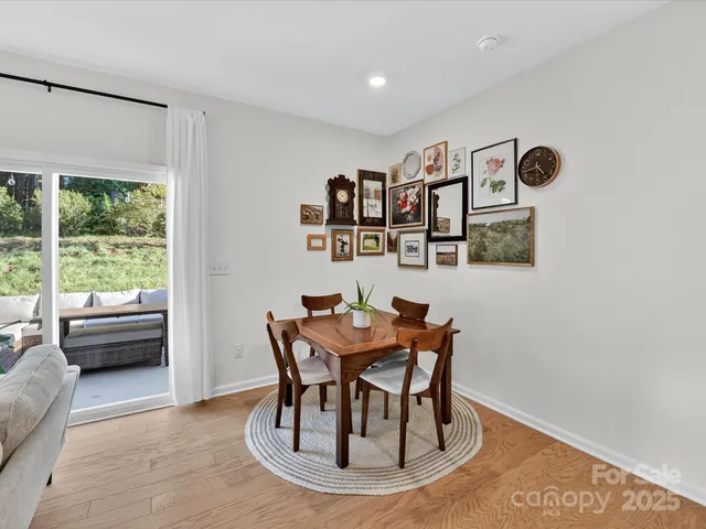 a dining room with furniture and a window