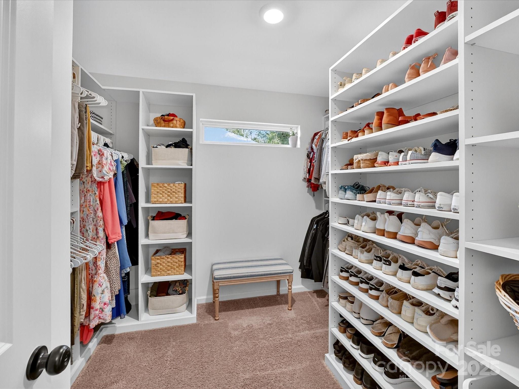 230 Quinn Road Matthews, NC 28104 - Photo 24 of 35 a view of walk in closet with clothes and shoes