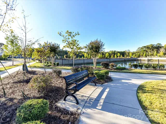 a view of an ocean with boats and trees all around