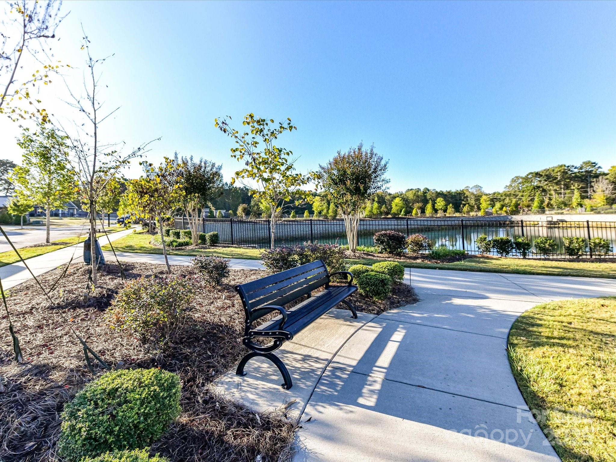 230 Quinn Road Matthews, NC 28104 - Photo 34 of 35 a view of a swimming pool with a patio and furniture