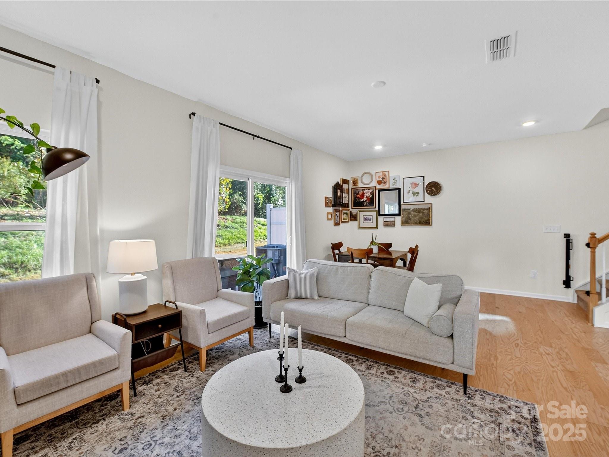 230 Quinn Road Matthews, NC 28104 - Photo 6 of 35 a living room with furniture and a large window