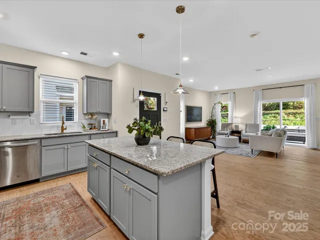 a kitchen with sink and center island