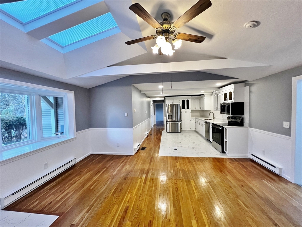 6 Mayfield Road Auburn, MA 01501 - Photo 11 of 30 a large kitchen with stainless steel appliances granite countertop a sink and cabinets