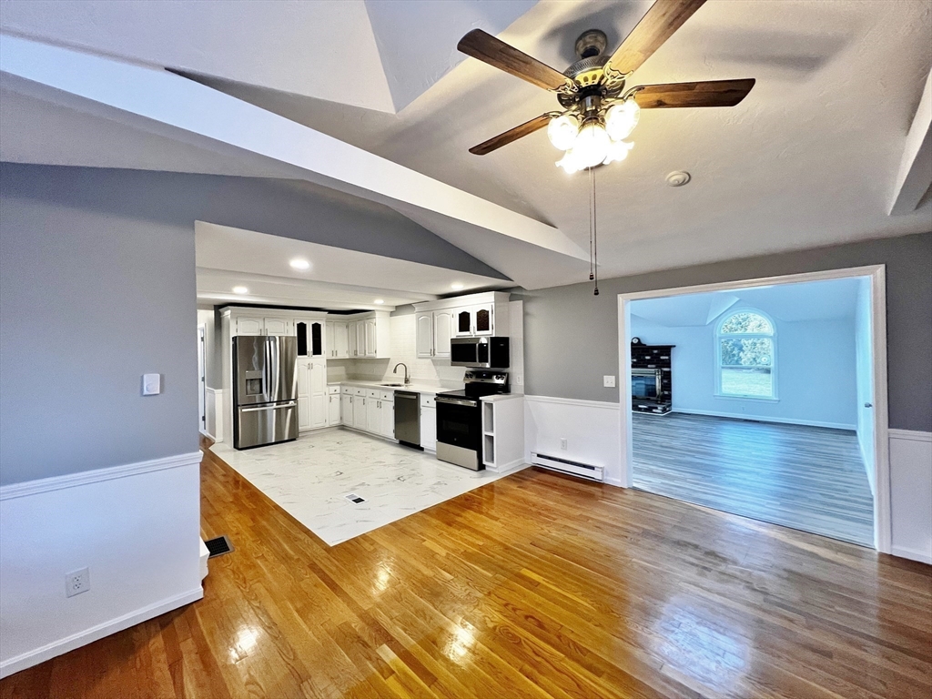 6 Mayfield Road Auburn, MA 01501 - Photo 13 of 30 a living room with furniture and a chandelier