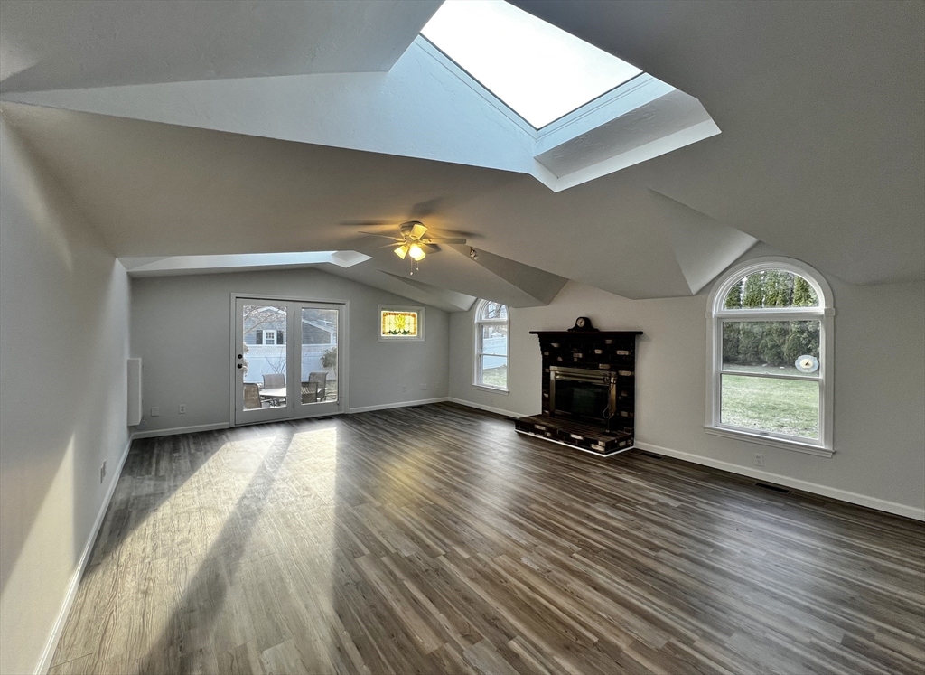 6 Mayfield Road Auburn, MA 01501 - Photo 14 of 30 a view of an empty room with a window and wooden floor
