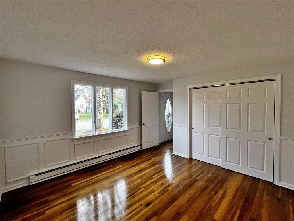6 Mayfield Road Auburn, MA 01501 - Photo 24 of 30 a view of an empty room with wooden floor and a window