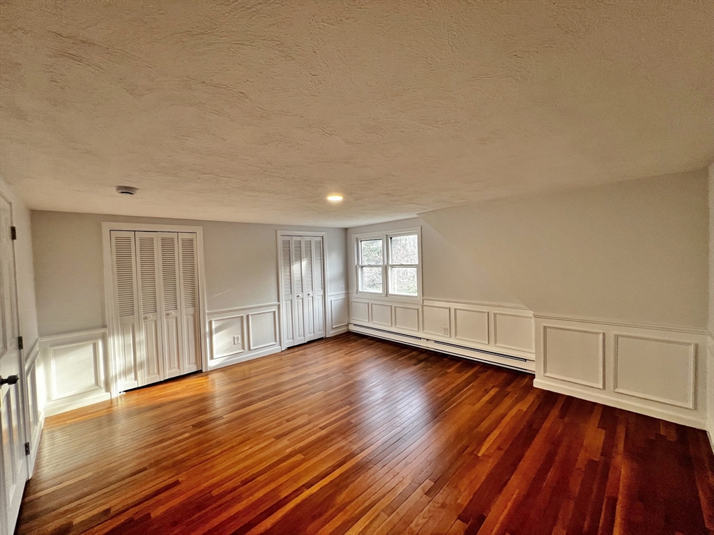 6 Mayfield Road Auburn, MA 01501 - Photo 27 of 30 a view of empty room with wooden floor and fan