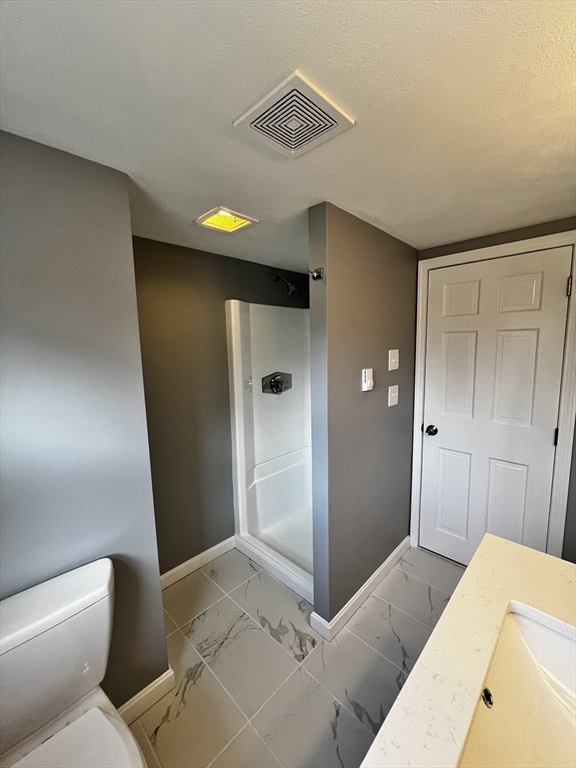 6 Mayfield Road Auburn, MA 01501 - Photo 30 of 30 a bathroom with a toilet and a shower