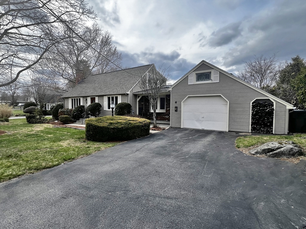 6 Mayfield Road Auburn, MA 01501 - Photo 3 of 30 a front view of a house with a garden and trees