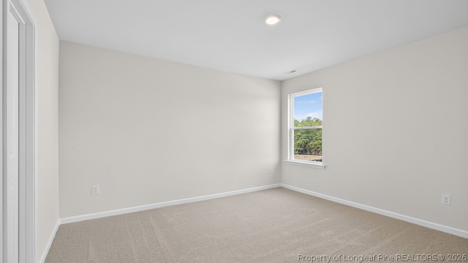 123 Charlies Bnd Way Spring Lake, NC 28390 - Photo 26 of 34 an empty room with windows