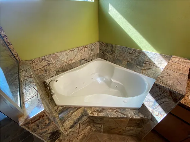 a bath tub sitting in a bathroom