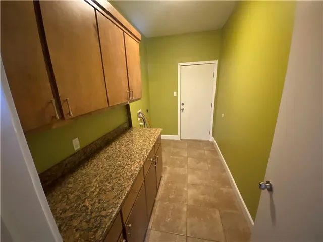 a view of hallway with wooden floor