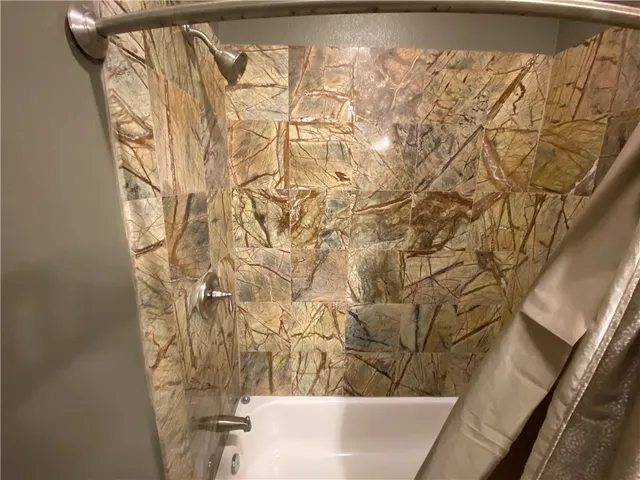 a view of a bathtub in a bathroom