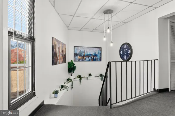 a view of a hallway with windows