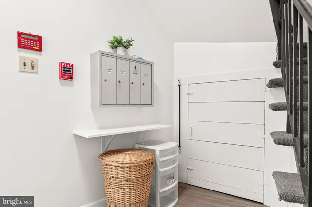 a view of storage and utility room with racks on the wall