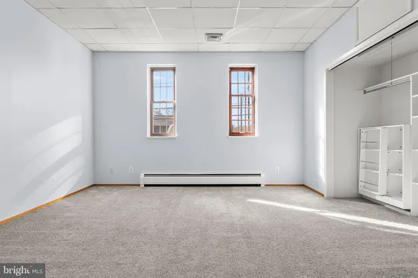 an empty room with windows